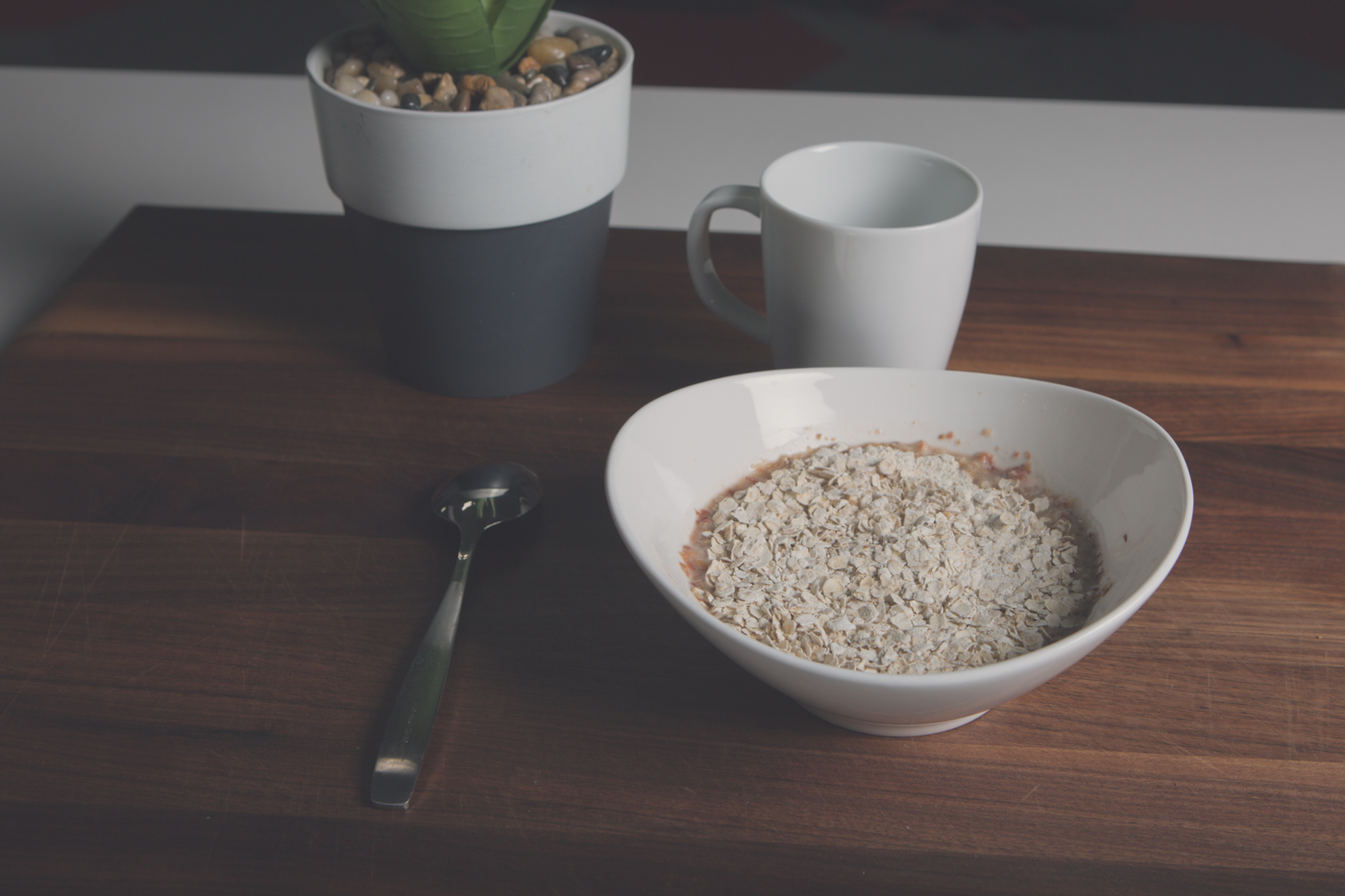 Bowl of oatmeals on timber table